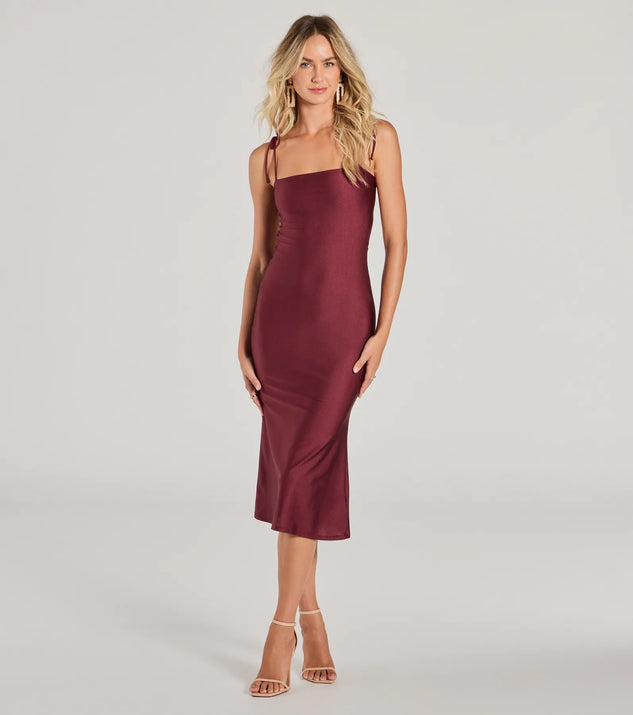 With its mid-calf hem and popular flattering fit, the Something About Her Strappy Back Bodycon Midi Dress in raisin purple nails the balance of trend and ease, redefining go-to midi dresses for any occasion.