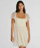 The Raise A Toast Puff Sleeve Faux Pearl Babydoll Dress is a mini dress that will make a statement with its short hemline and on-trend details to have you ready for any event!