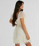 The Raise A Toast Puff Sleeve Faux Pearl Babydoll Dress is a mini dress that will make a statement with its short hemline and on-trend details to have you ready for any event!
