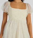 Step into winter chic with the Raise A Toast Puff Sleeve Faux Pearl Babydoll Dress, a ivory mini dress featuring an above-the-knee cut ideal for cocktail parties, festive gatherings, or clubwear.