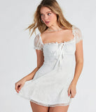 Step into seasonal chic with the Lovely In Lace Ruffled Puff Sleeve Mini Dress, a white mini dress featuring an above-the-knee cut ideal for cocktail parties, festive gatherings, or clubwear.