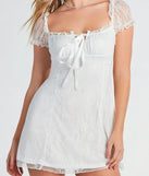 The Lovely In Lace Ruffled Puff Sleeve Mini Dress is a stylish white lace dress, designed with intricate lace and an alluring silhouette, making it an elegant choice for graduation photoshoots, weddings, or effortless spring looks.
