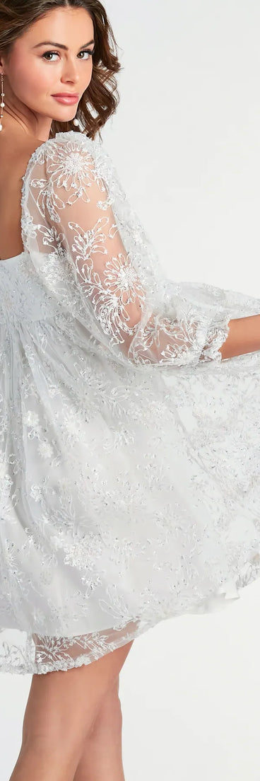 Step into winter chic with the Beautiful Bliss Floral Sequin Mesh Babydoll Dress, a ivory mini dress featuring an above-the-knee cut ideal for cocktail parties, festive gatherings, or clubwear.