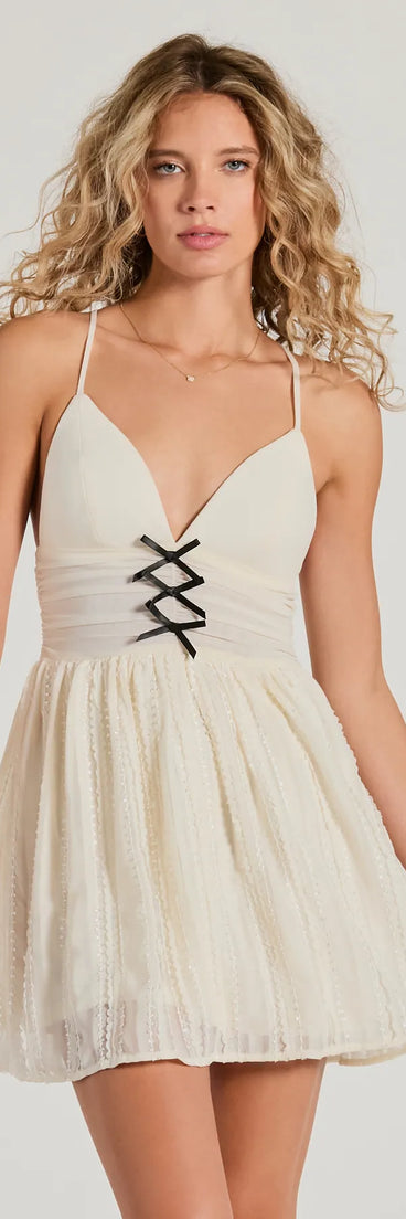 Step into winter chic with the All About Her V-Neck Bow Lace Skater Dress, a ivory mini dress featuring an above-the-knee cut ideal for cocktail parties, festive gatherings, or clubwear.