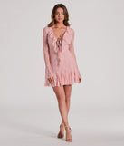 The Dreamy Mix Long Sleeve Ruffle Lace A-Line Dress is a stunning pink mini dress with a short hem, designed to be the perfect winter cocktail dress or night-out look for the holiday season.