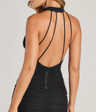 The Irresistibly Bold Halter Strappy Bodycon Midi Dress in black is an elevated cocktail dress featuring a chic silhouette, perfect for wedding events or bridal parties.