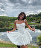 The So Darling Woven Drop-Waist Skater Dress in white brings sleek style to any graduation outfit, from cap and gown to after-party.