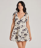 Step into winter chic with the Chantel Bow Tie V-Neck Floral Ruffle Skater Dress, a ivory mini dress featuring an above-the-knee cut ideal for cocktail parties, festive gatherings, or clubwear.