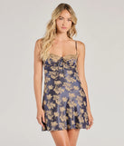 Step into winter chic with the Tied To You Lace Trim A-Line Floral Satin Dress, a navy mini dress featuring an above-the-knee cut ideal for cocktail parties, festive gatherings, or clubwear.