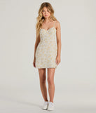 The Ultimate Chic Choice Floral Tie-Back Short Dress is a stunning ivory mini dress with a short hem, designed to be the perfect winter cocktail dress or night-out look for the holiday season.