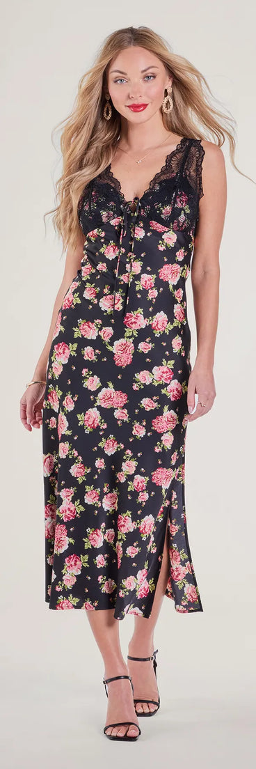 With its mid-calf hem and popular flattering fit, the Sunset Dinner Lace V-Neck Floral Satin Midi Dress in black nails the balance of trend and ease, redefining go-to midi dresses for any occasion.
