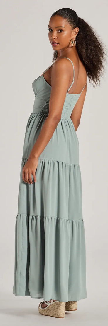 Soak up the season in the Casually Chic Sleeveless Ruffled Maxi Dress, a sage green sundress styled for easy days, outdoor plans, and everything in between.