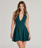 Step into seasonal chic with the Bring the Glam Glitter Halter Skater Dress, a hunter mini dress featuring an above-the-knee cut ideal for cocktail parties, festive gatherings, or clubwear.