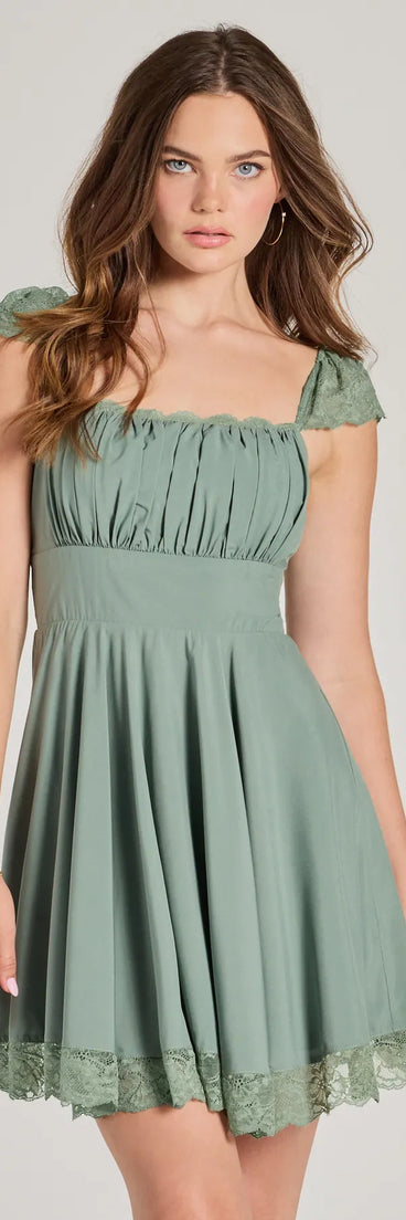Step into winter chic with the Darling Delight Sleeveless Lace Trim Skater Dress, a sage mini dress featuring an above-the-knee cut ideal for cocktail parties, festive gatherings, or clubwear.