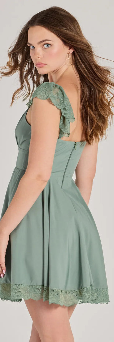 The Darling Delight Sleeveless Lace Trim Skater Dress is a mini dress in sage, perfect for an above-the-knee holiday party dress or a stylish NYE look, with a short hemline designed to make a winter statement.