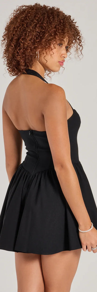 The Twirl Perfection Drop Waist Skater Dress in black brings sleek style to any graduation outfit, from cap and gown to after-party.