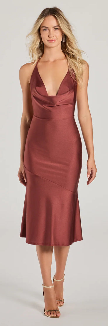 The Remarkable Appeal Cowl Halter A-Line Midi Dress in red is a modern red dress featuring trendy details and a stunning design ideal for wedding guest dresses, elegant cocktail looks, or an alluring Valentine’s Day dress.