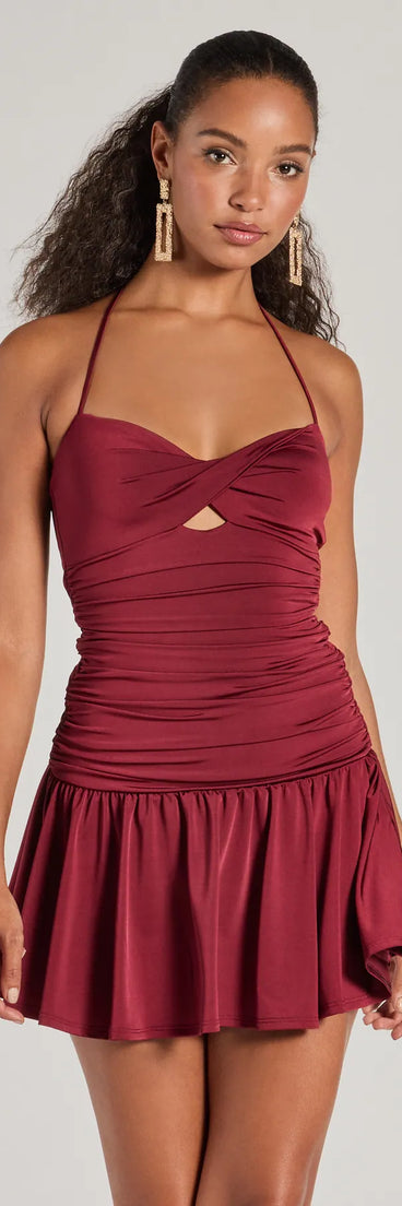 Step into winter chic with the Flirty Flair Ruched Drop Waist Skater Dress, a burgundy mini dress featuring an above-the-knee cut ideal for cocktail parties, festive gatherings, or clubwear.