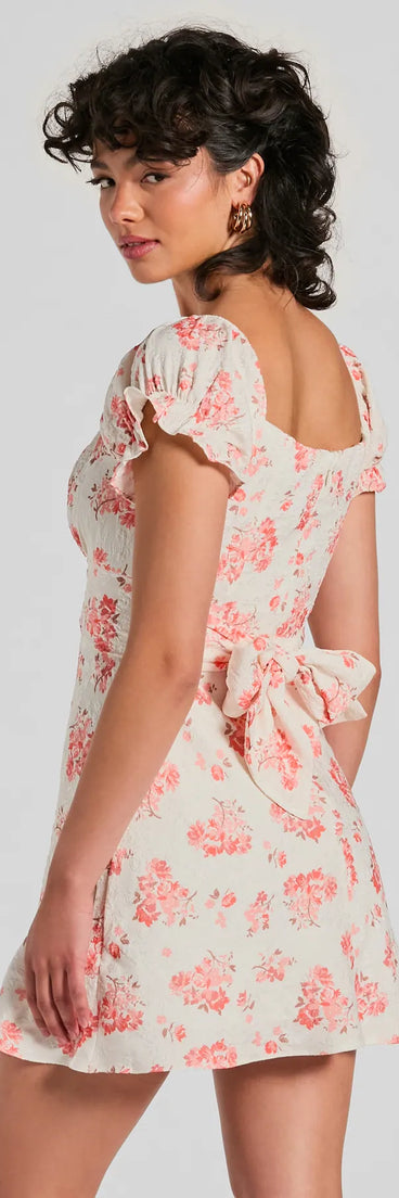 The Sure To Adore Puff Sleeve A-Line Short Floral Dress is a stylish ivory floral dress featuring a fresh seasonal print and flattering design, perfect for garden parties, bridal showers, Valentine's Day celebrations, or everyday spring styling.