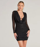 Step into seasonal chic with the VIP Beauty Mesh Rhinestone Long Sleeve Mini Dress, a black mini dress featuring an above-the-knee cut ideal for cocktail parties, festive gatherings, or clubwear.