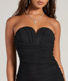 Revamp your 2025 wardrobe with this chic addition, the Sleek Sophistication Sleeveless Ruched Midi Dress in black, perfect for elevating your style in the new year.