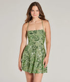 Turn heads in the beaming Sparkling Beauty Lace-Up Floral Sequin Skater Dress, a stunning sage sequin dress designed to add sparkle and elegance to your next night out or special occasion.