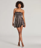 Make a bold statement in the Luxe Enchantment Glitter Tube Ruffled Skater Dress in black, the perfect spring dress for weddings, cocktail hours, nights out, and/or seasonal celebrations.