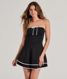 Step into seasonal chic with the Stylish Impression Strapless Ruffled Skater Dress, a black mini dress featuring an above-the-knee cut ideal for cocktail parties, festive gatherings, or clubwear.