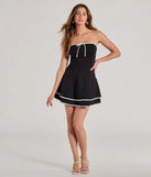 Make a bold statement in the Stylish Impression Strapless Ruffled Skater Dress in black, the perfect spring dress for weddings, cocktail hours, nights out, and/or seasonal celebrations.