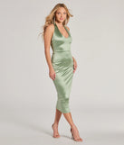 Revamp your 2025 wardrobe with this chic addition, the Celebrate Love Halter V-Neck Bodycon Satin Midi Dress in sage green, perfect for elevating your style in the new year.