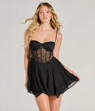 Step into seasonal chic with the Sultry Vibes Sheer Lace Corset Skater Dress, a black mini dress featuring an above-the-knee cut ideal for cocktail parties, festive gatherings, or clubwear.