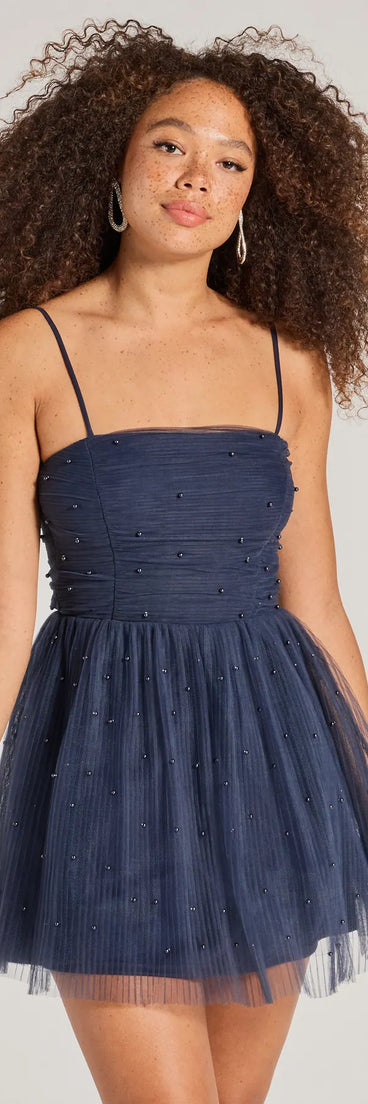 Turn heads at Prom 2025 in this navy blue prom dress, where statement-making details meet the iconic style of the Major Stunner Tulle and Pearl Skater Dress .