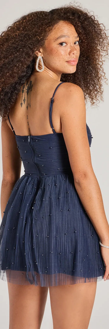 Revamp your 2025 wardrobe with this chic addition, the Major Stunner Tulle and Pearl Skater Dress in navy, perfect for elevating your style in the new year.