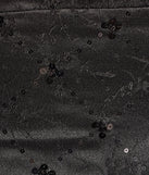 The Glitzy Chic Sequin Woven Drop Waist Skater Dress is a stylish black floral dress featuring a fresh seasonal print and flattering design, perfect for garden parties, bridal showers, grad parties, or everyday spring styling.