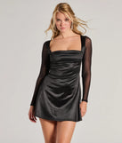 Step into seasonal chic with the Chic Era Satin And Mesh Long Sleeve Mini Dress, a black mini dress featuring an above-the-knee cut ideal for cocktail parties, festive gatherings, or clubwear.