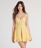 Feel confident and photo-ready in the Spring Forward Strappy Back Floral Skater Dress, a yellow graduation dress perfect for 2025 ceremonies and parties.