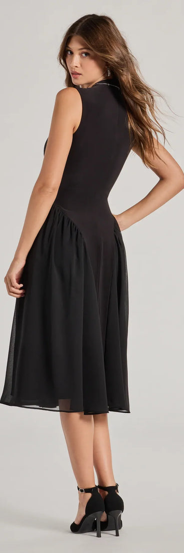 The Chic Trendsetter Knit Chiffon Drop Waist Midi Dress in black is a women's workwear piece offering a trendy style and unique accents, perfect for effortlessly creating an outfit-of-the-day look that transitions your office look to going-out ready.