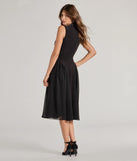 The Chic Trendsetter Knit Chiffon Drop Waist Midi Dress in black is a women's workwear piece offering a trendy style and unique accents, perfect for effortlessly creating an outfit-of-the-day look that transitions your office look to going-out ready.