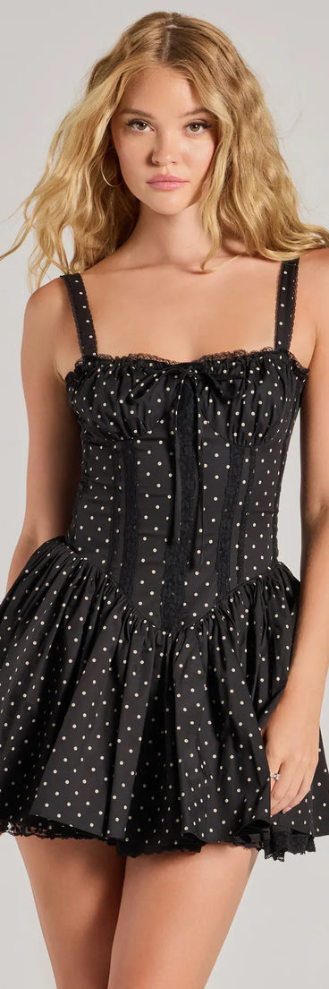 Step into seasonal chic with the Pretty Vibes Polka Dot Drop Waist Skater Dress, a black mini dress featuring an above-the-knee cut ideal for cocktail parties, festive gatherings, or clubwear.