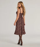The Chic Fall Vibe Ditsy Floral Corset Midi Dress in brown is a women's workwear piece offering a trendy style and unique accents, perfect for effortlessly creating an outfit-of-the-day look that transitions your office look to going-out ready.
