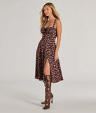The Chic Fall Vibe Ditsy Floral Corset Midi Dress in brown is a women's workwear piece offering a trendy style and unique accents, perfect for effortlessly creating an outfit-of-the-day look that transitions your office look to going-out ready.