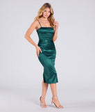 Make a bold statement in the Sleek And Iconic Satin Bodycon Midi Dress in hunter green, the perfect green dress for weddings, cocktail hours, nights out, and/or seasonal celebrations.