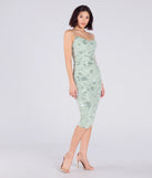Make a bold statement in the Cocktail Soiree Floral Velvet Midi Dress in sage green, the perfect green dress for weddings, cocktail hours, nights out, and/or seasonal celebrations.