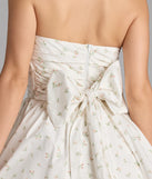 Shine with confidence, elegance, and standout style in the Loveliest Of Them All Bow Floral Skater Dress—a white graduation dress designed with a fresh silhouette and the latest trends.