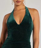 Make a bold statement in the Sparkling Glam Velvet Glitter Halter Midi Dress in hunter green, the perfect green dress for weddings, cocktail hours, nights out, and/or seasonal celebrations.