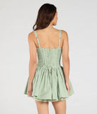 So Darling Woven Drop-Waist Skater Dress, a trendy sage green mini dress featuring modern details and a fresh seasonal hue, perfect for creating chic 2025 looks.