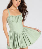 So Darling Woven Drop-Waist Skater Dress, a trendy sage green mini dress featuring modern details and a fresh seasonal hue, perfect for creating chic 2025 looks.