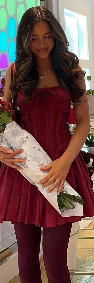 Soak up the season in the So Darling Woven Drop-Waist Skater Dress, a wine sundress styled for easy days, outdoor plans, and everything in between.