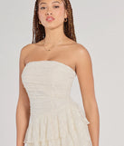 The Lovely Nights Strapless Lace Ruffle Skater Dress is a stylish ivory lace dress, designed with intricate lace and an alluring silhouette, making it an elegant choice for graduation photoshoots, weddings, or effortless spring looks.