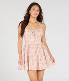 Make a bold statement in the Twirling Beauty Halter Floral Skater Dress in pink, the perfect spring dress for weddings, cocktail hours, nights out, and/or seasonal celebrations.